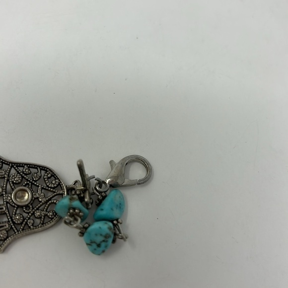 Fatima's hand bracelet with silver-colored turquoise stones and red Stones. - Picture 2 of 6